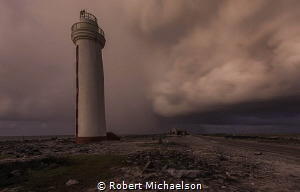 Passing Storm at dawn at dive site Lighthouse Point, Bonaire by Robert Michaelson 